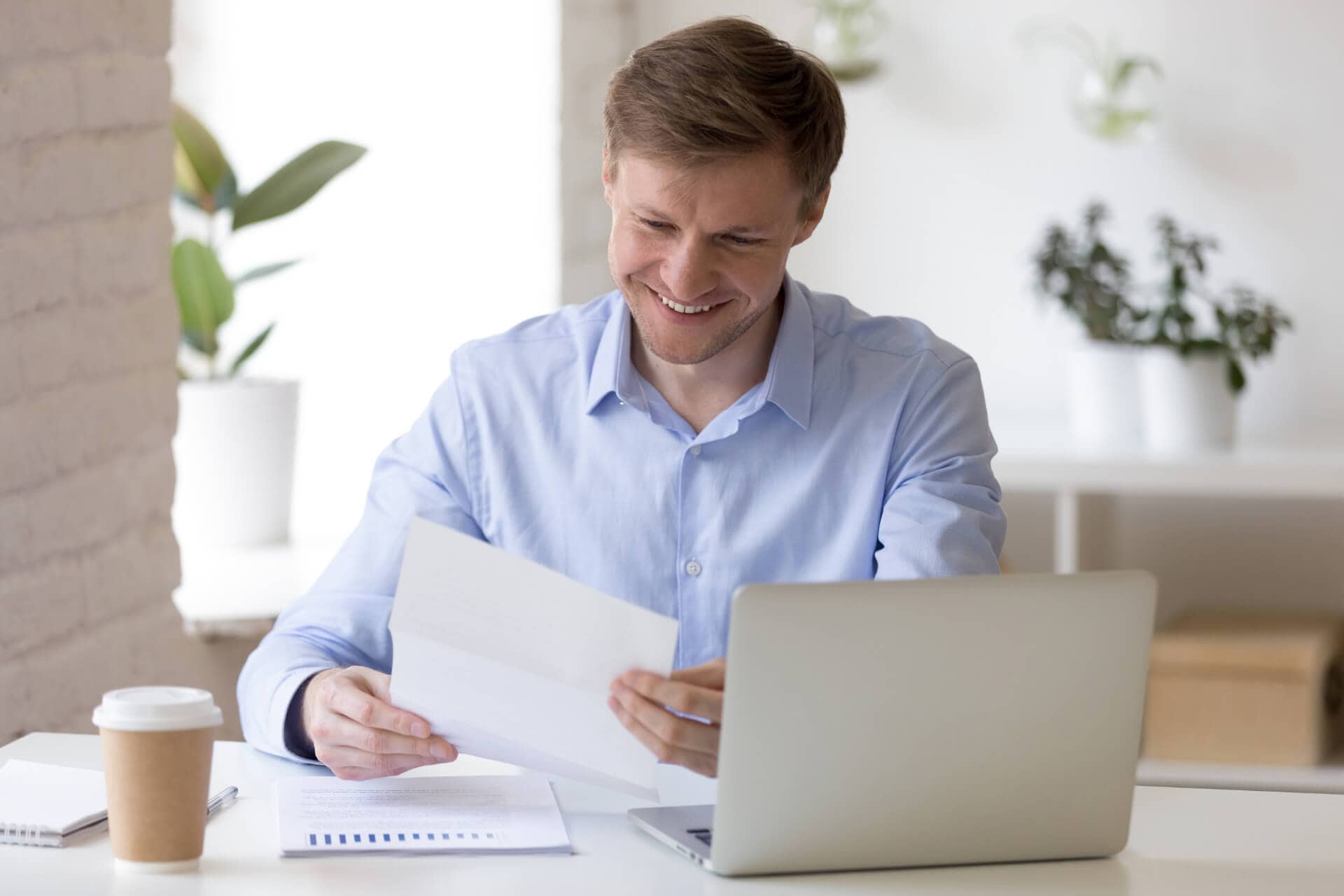 news_1 A man at a desk with a laptop financial wellbeing