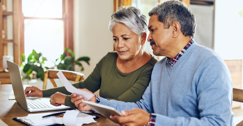 boost your pension senior couple looking at their pension plan