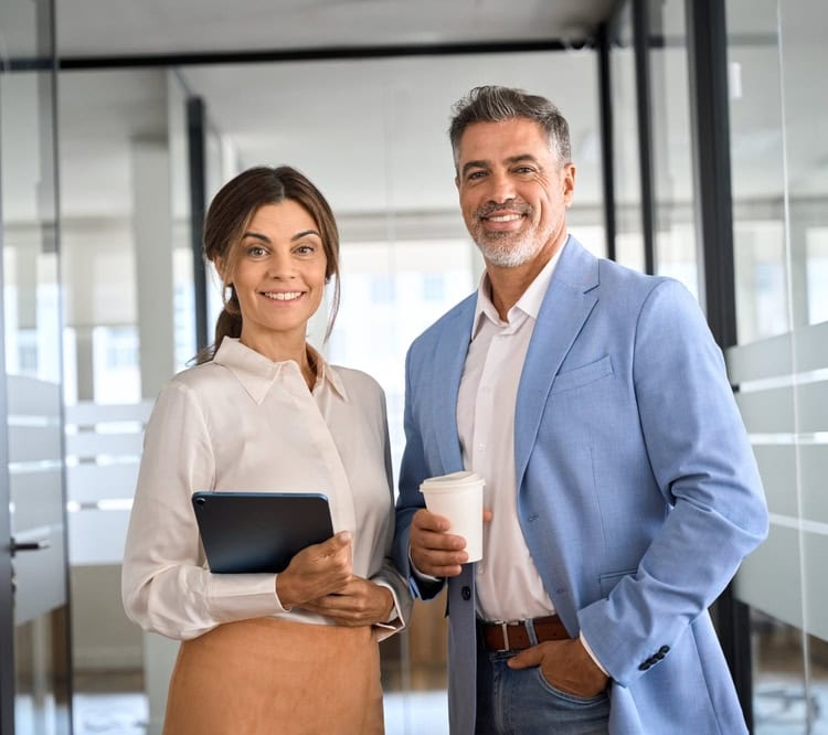 Portrait,Of,Two,Happy,Executives,Business,Man,And,Woman,Partners male and female business executives smiling